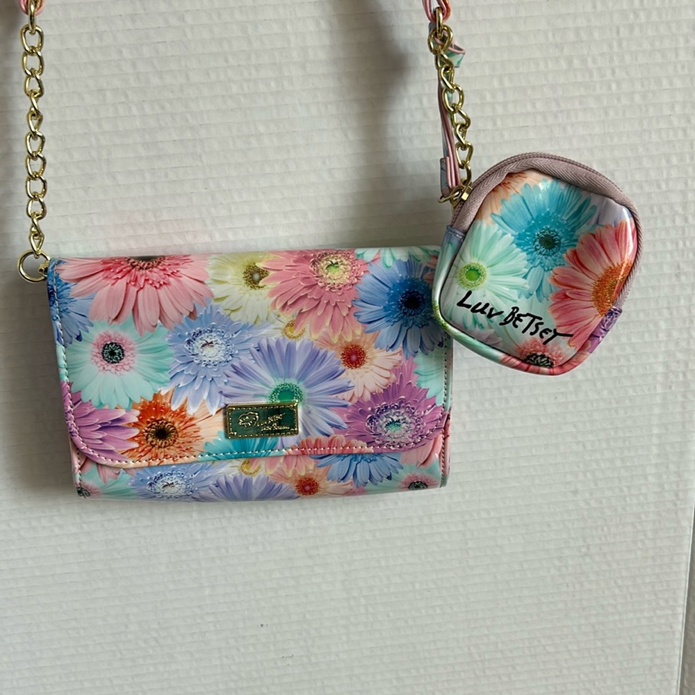 Betsey Johnson Luv Betsey pastel floral crossbody with attached ear bud case.